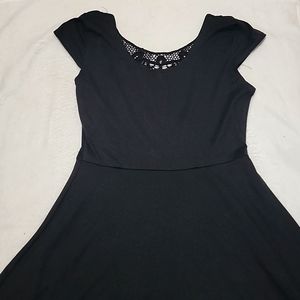Black knee length short sleeve dress with see through back pattern
